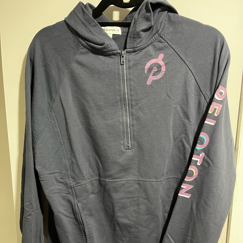 2 Peloton Outerwear, 1 hoodie dark purple and 1 pullover in lavender.